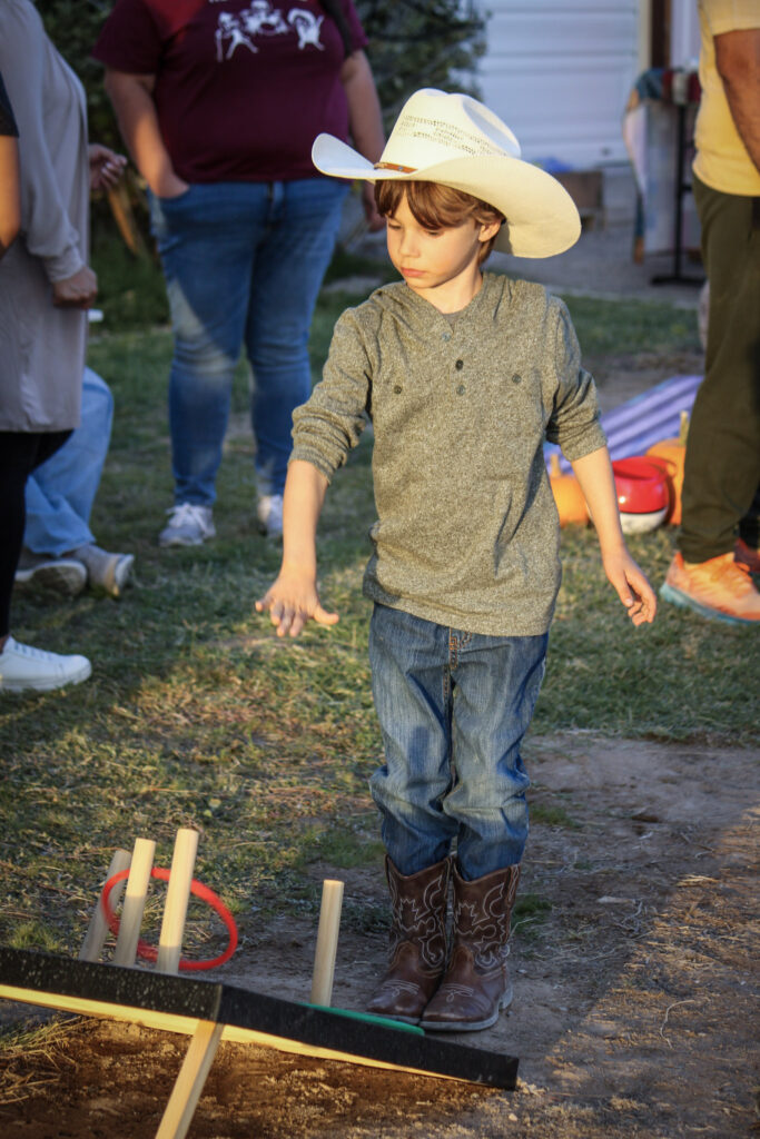 child playing games at pahrumpkin patch at green life produce